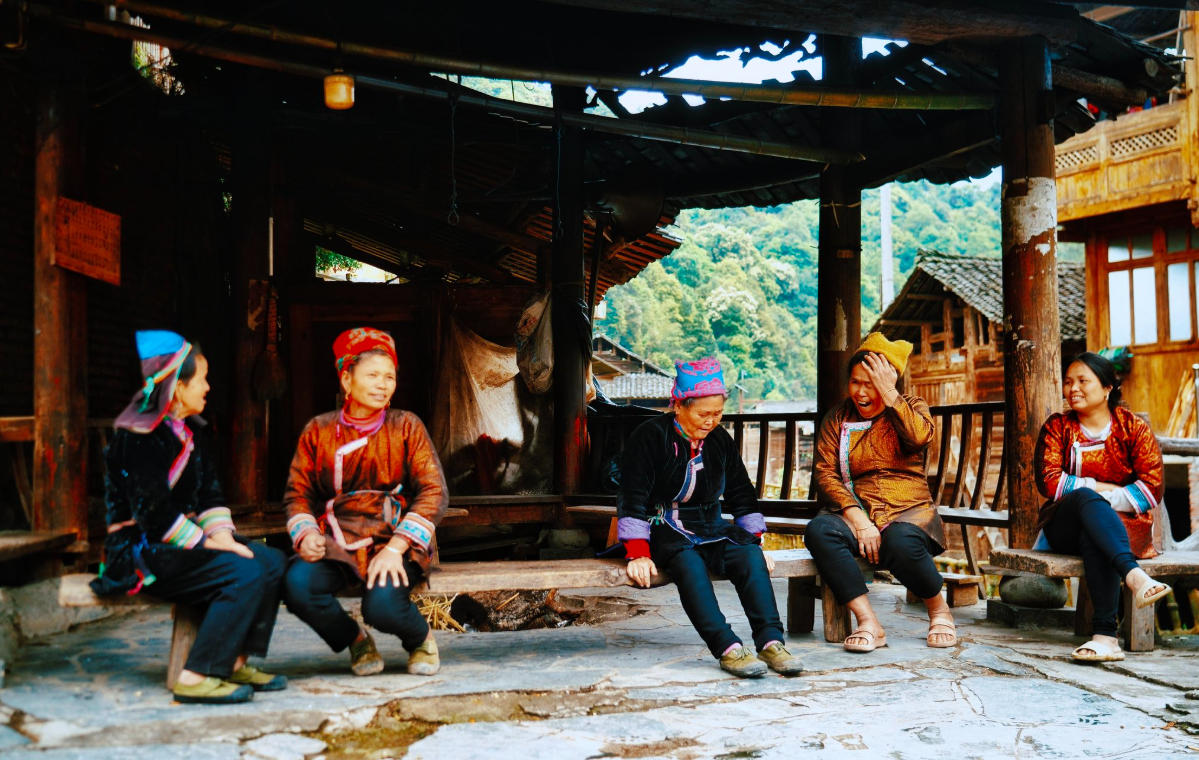 Dong Women Sitting and Chatting