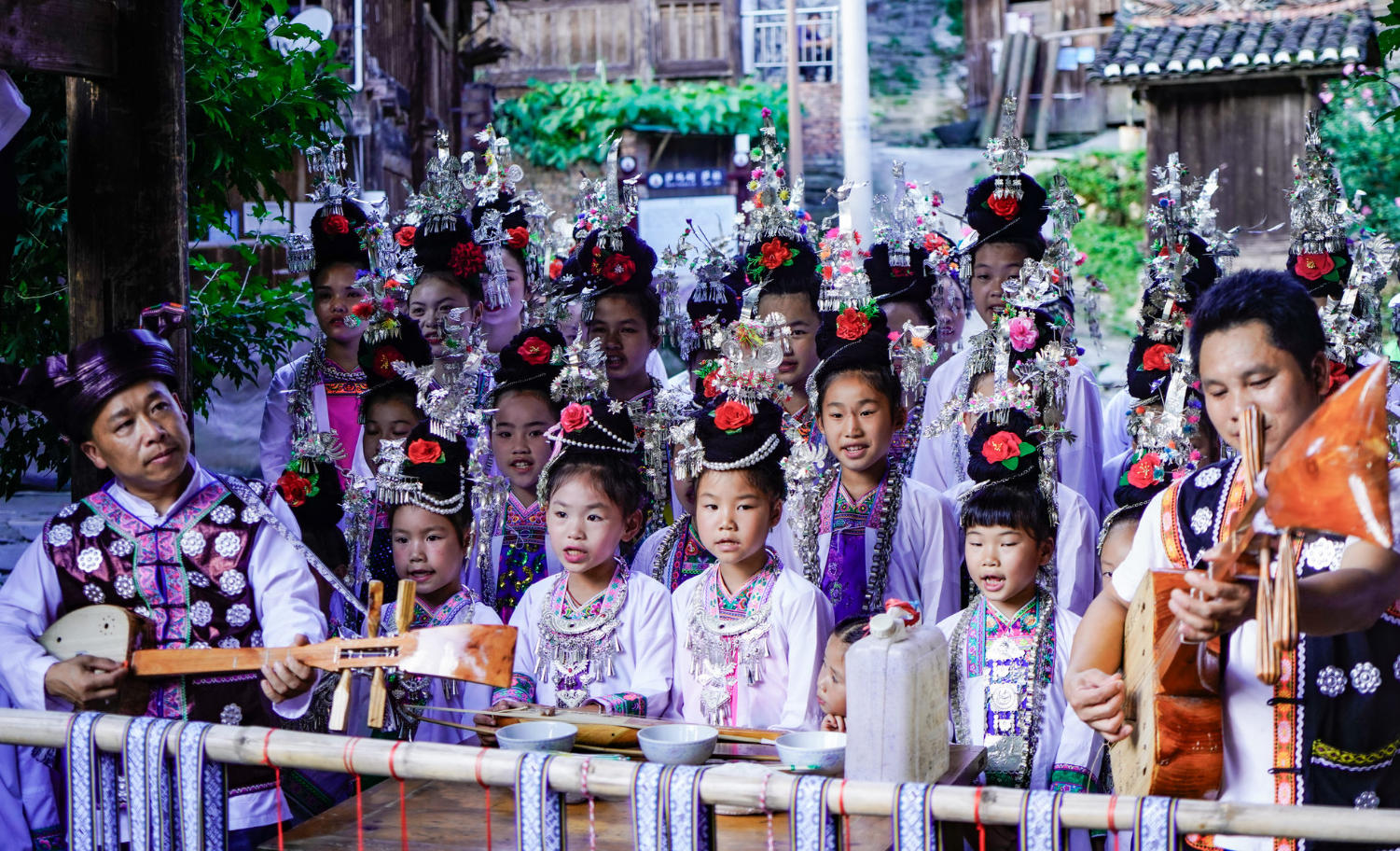 A group of children in Zaidang Dong Village singing the traditional Dong Grand Songs together