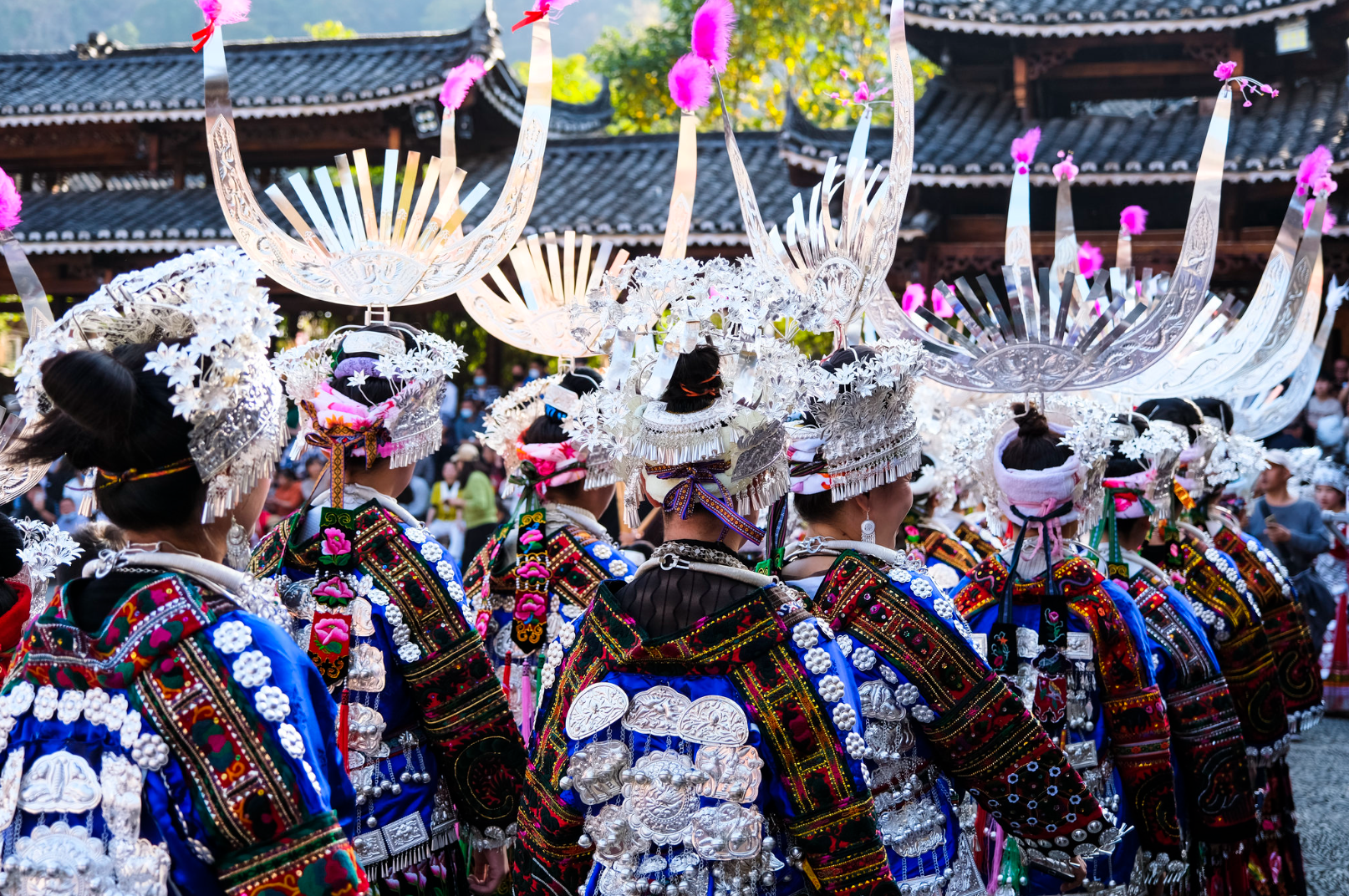 Xijiang Qianhu Miao Village Guide: Exploring China’s Largest Miao Village in Guizhou Miao people in traditional clothing walking through Xijiang Qianhu Miao Village, the largest Miao settlement in Guizhou, China.